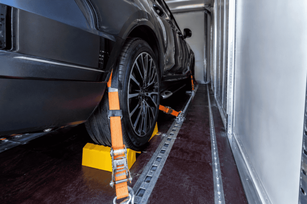 Enclosed car shipping wheel tie down secure loading Enclosed car shipping wheel tie down secure loading